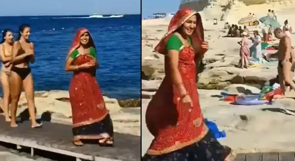 Shocking Video: समुद्र किनारे घूंघट में दिखी महिला, बिकिनी पहने लोगों ने दिया ऐसा रिएक्शन
