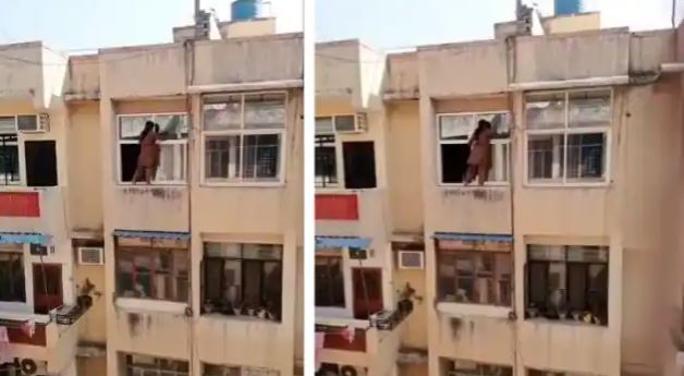 Viral video: खिड़की पर लटकर महिला का सफाई करते वीडियो वायरल, लोगों ने बताया-खतरों का खिलाड़ी