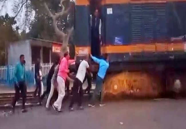 Railway employees pushed the train to the station