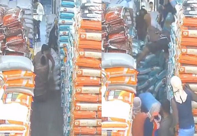 Sacks filled with grains suddenly fell on a woman who was cleaning.