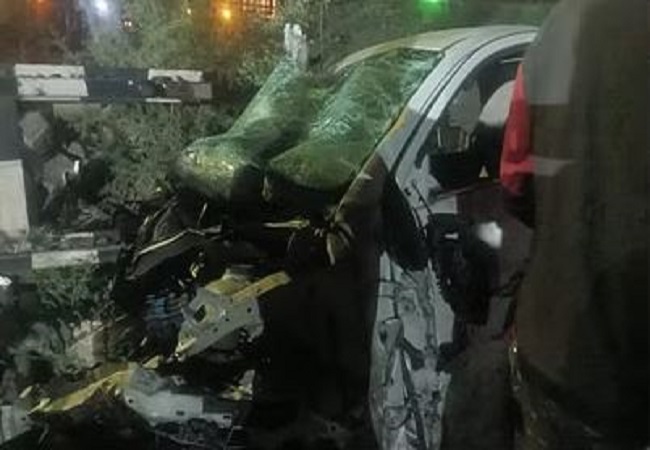 Car collides with moving train