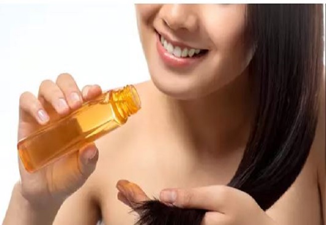 applying oil to hair