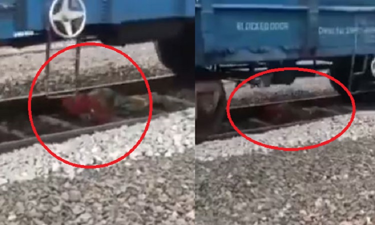 Train passes over woman lying on railway track