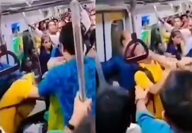 Two people fight fiercely over seat in Delhi Metro