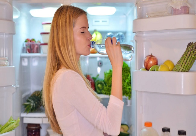 water bottle from the fridge and drink it while standing