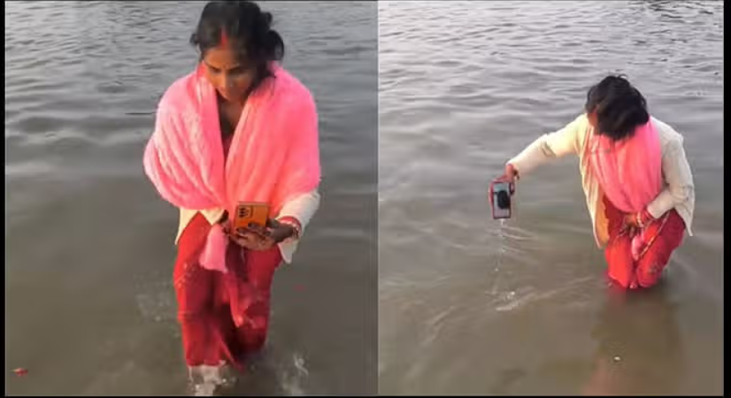 वीडियो कॉल पर महिला ने पति को लगवाई संगम में डुबकी, देखें वीडियो
