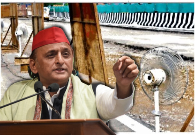 लखनऊ-कानपुर एक्सप्रेसवे की मरम्मत के दौरान पंखे से सुखायी जा रही है सड़क, अखिलेश बोले- ये है भाजपाई तरक़्क़ी की नई हवा
