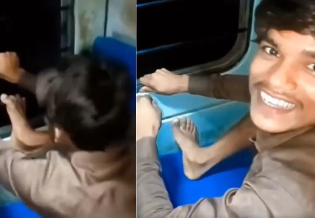 ट्रेन की खिड़की तोड़ते हुए एक युवक ले रहा मजे, सोशल मीडिया पर वीडियो वायरल होते ही फूटा यूजर्स का गुस्सा